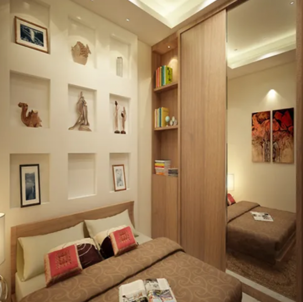 Kamar tidur dengan lemari yang berfungsi sebagai partisi ruangan